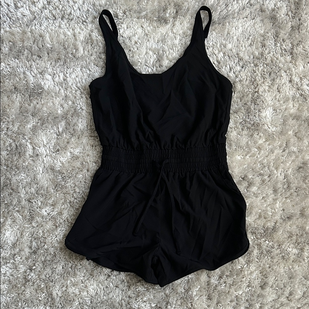 Vanilla Star Black One Piece with Pockets, tie front, and adjustable straps!